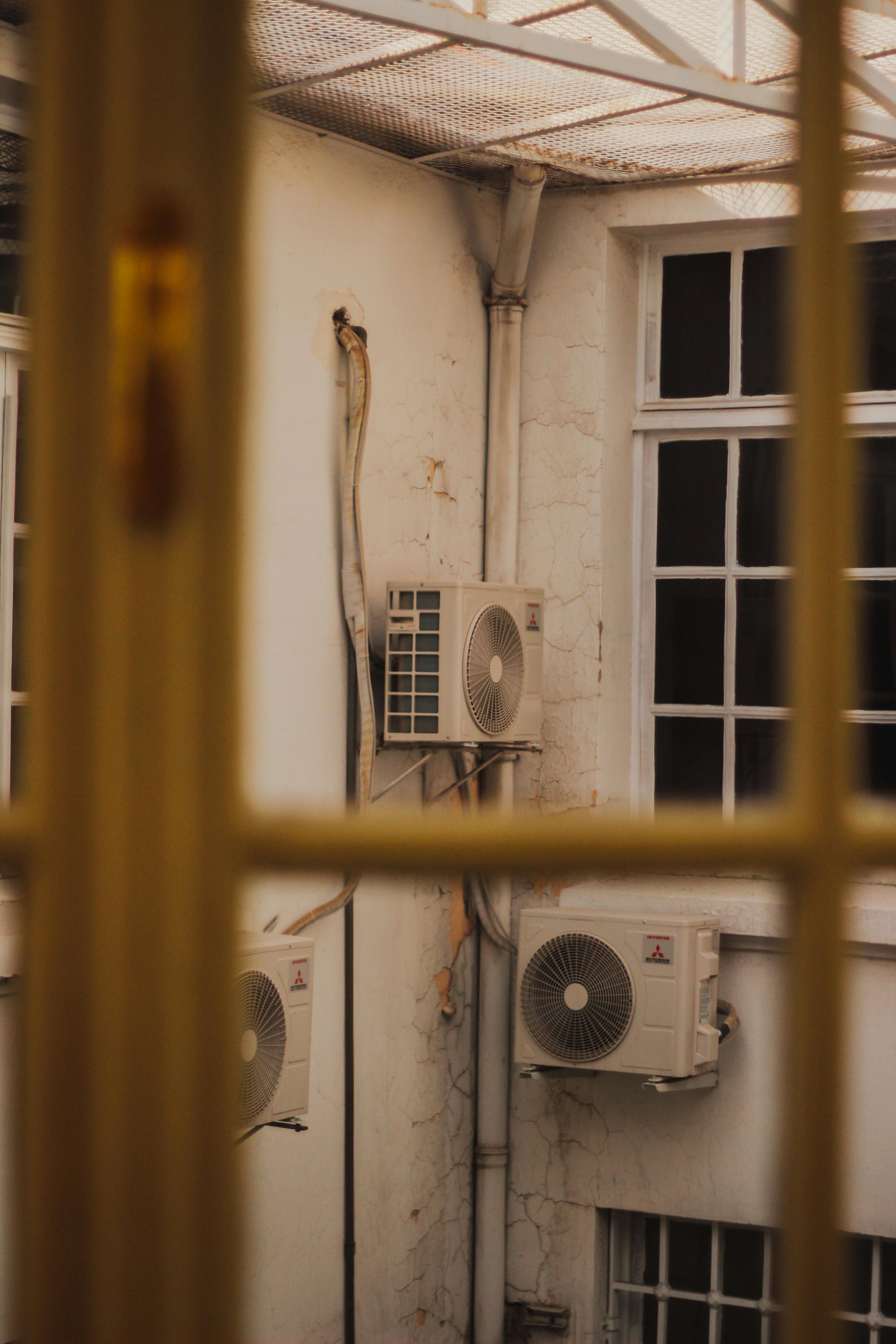 Multiple air conditioning units professionally installed on building exterior